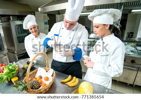Chef and kitchen staff. Teamwork