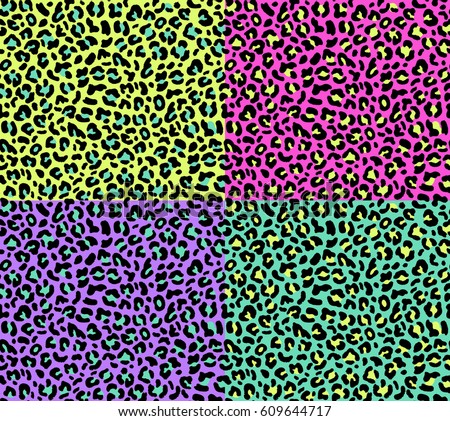 Set of four seamless leopard patterns 80s 90s style.Fashionable exotic animal prints with bright neon colors- pink,green,violet,yellow.Vector