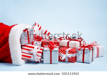 Bag of Santa Claus with gifts on blue background