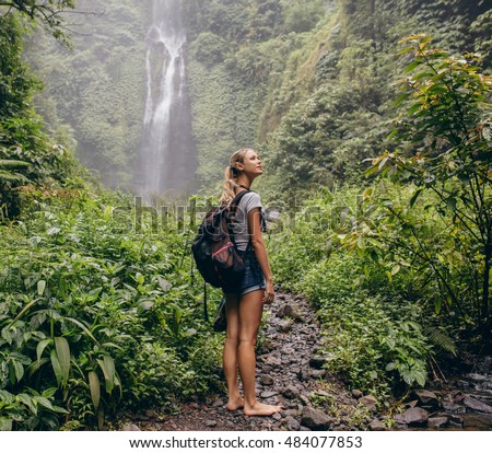 https://thumb1.shutterstock.com/display_pic_with_logo/163108/484077853/stock-photo-beautiful-woman-hiker-standing-on-forest-trail-and-looking-away-female-with-backpack-on-hike-in-484077853.jpg