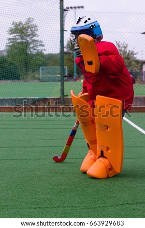 stock-photo-field-hockey-goalie-in-pract