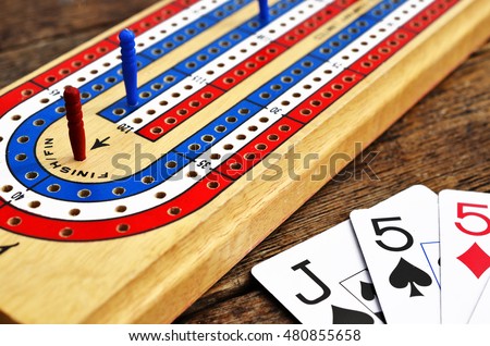 A Low Angle View Of Cribbage Board With Red Peg In The Winning A Low Angle View Of Cribbage Board With Red Peg In The Winning