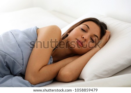 Beautiful Young Woman Sleeping While Lying Stock Photo 1058859479