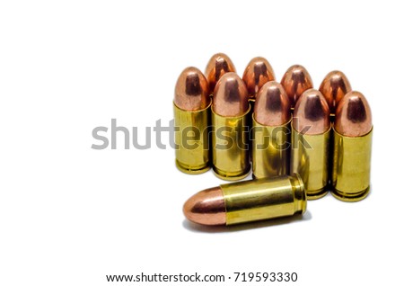 Bullets on white background. A group of 9mm bullets for a gun isolated on white background. Ammunition on white background.