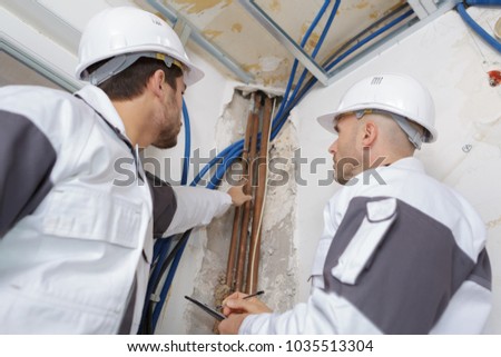 plumbers working in home being renovated