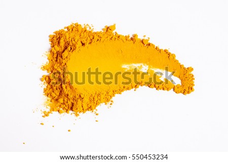 Smear of turmeric. Isolated on white. Up view.