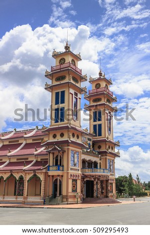 TAY NINH, VIETNAM - October 23, 2016:Cao Dai temple area and meditating followers of the Cao Dai religion in the temple Cao Dai