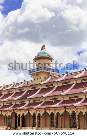TAY NINH, VIETNAM - October 23, 2016:Cao Dai temple area and meditating followers of the Cao Dai religion in the temple Cao Dai