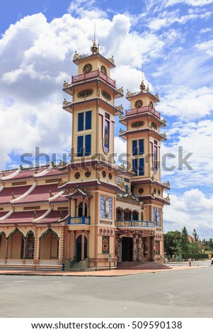 TAY NINH, VIETNAM - October 23, 2016:Cao Dai temple area and meditating followers of the Cao Dai religion in the temple Cao Dai