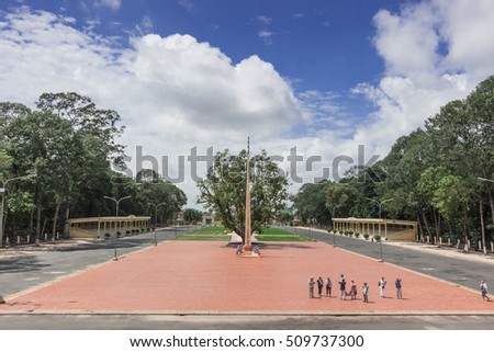 TAY NINH, VIETNAM - October 23, 2016:garden of Cao Dai temple and meditating followers of the Cao Dai religion in the temple Cao Dai