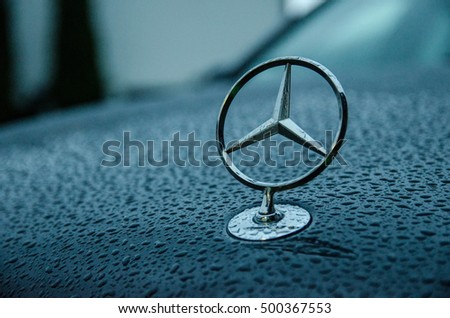 Erkrath, Germany - 11.02.13: Mercedes-benz hood emblem on a cloudy and rainy day.