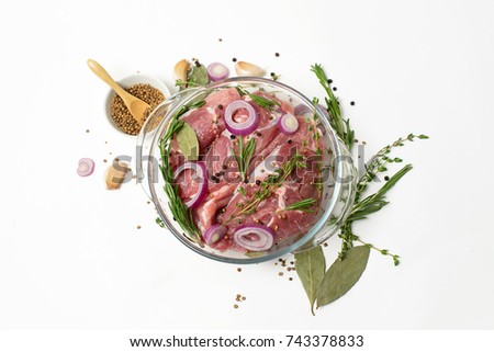 stock-photo-culinary-concept-raw-pork-meat-with-herbs-and-spices-on-white-background-743378833.jpg
