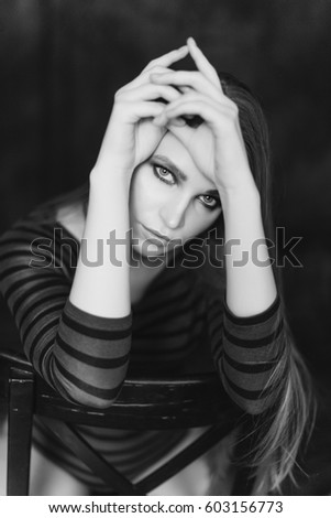 Black and white portraits of a beautiful girl on a dark background long beautiful hair Black and white portraits of a beautiful girl on a dark background long beautiful hair