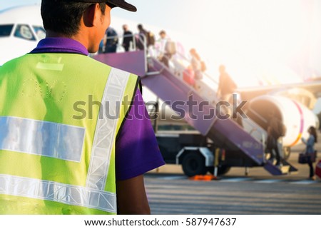 airport staff looking at aircraft