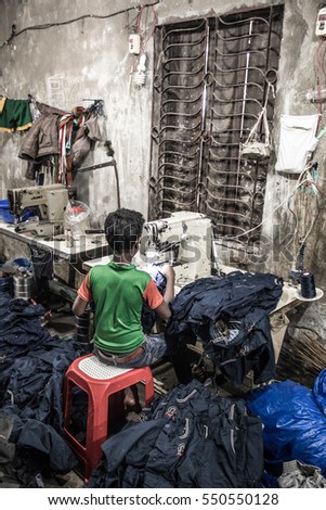 DHAKA, BANGLADESH - JANUARY 06, 2017: Child labor in a garment factory in Bangladesh