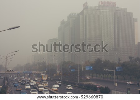 24 October,2014 - Beijing China. Air pollution in Beijing China city center,countless cars stuck on the road,the building beides are Sinopec(the China Petroleum and Chemical Corporation) and a bank