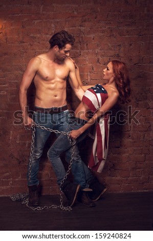 https://thumb1.shutterstock.com/display_pic_with_logo/1672675/159240824/stock-photo-handsome-sexy-man-holding-a-girl-with-a-chain-beautiful-girl-covers-her-body-with-american-flag-159240824.jpg