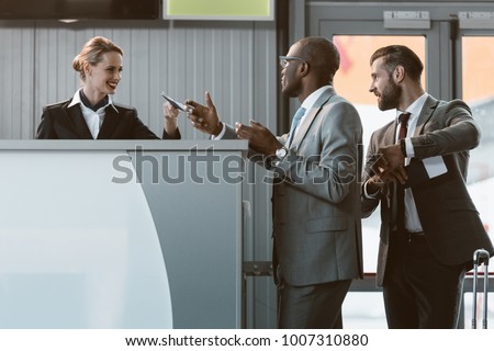 businessman standing at airport check in counter, hurry up on plane concept