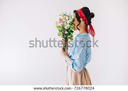 https://thumb1.shutterstock.com/display_pic_with_logo/167881400/726778024/stock-photo-side-view-of-woman-covering-face-with-bouquet-of-flowers-isolated-on-grey-726778024.jpg