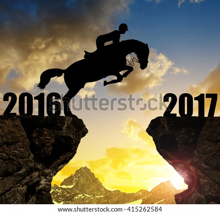 The rider on the horse jumping into the New Year 2017