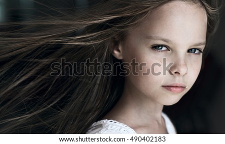 Sad little girl with tears on pretty face. Crying kid. Facial expression.