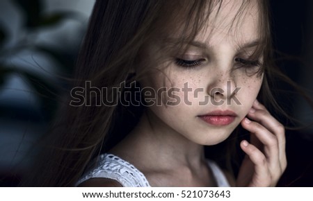 Sad little girl with tears on pretty face. Crying kid. Facial expression.