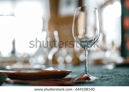 Wine Glasses And Table Serving In Rustic Style Restaurant Wine Glasses And Table Serving In Rustic Style Restaurant