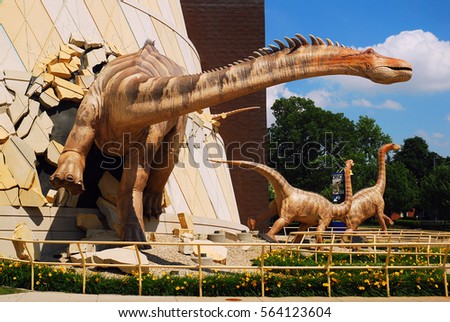 Indianapolis, IN, USA June 3, 2010 A dinosaur "breaks out" of the wall at the Indianapolis Children's Museum in Indianapolis, Indiana