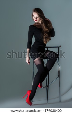 stock-photo-beautiful-girl-sitting-on-a-