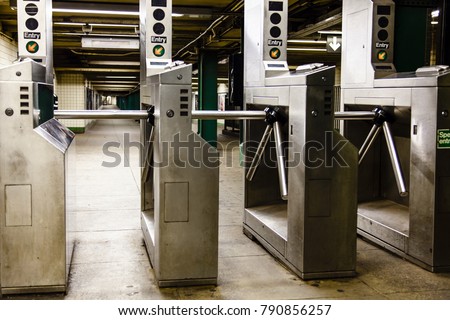 Turnstiles (baffle gates) in a New-York subway station.