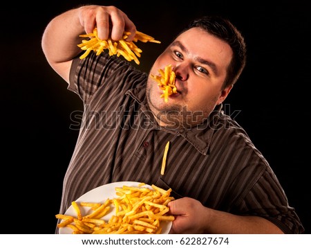 Fat Man Eating Potatoes On A Diet