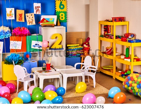 Kindergarten interior decoration child picture wall. Preschool class waiting kids. Colour balloons on floor