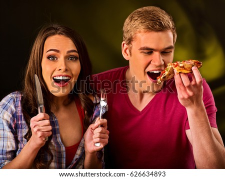 https://thumb1.shutterstock.com/display_pic_with_logo/172021/626634893/stock-photo-couple-eating-in-fast-food-restaurant-man-and-woman-eat-slice-pizza-with-knife-and-fork-friends-626634893.jpg