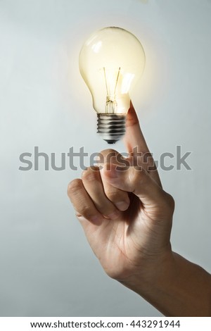 Hand Holding Glowing Light Bulb Stock Photo 132628175 - Shutterstock