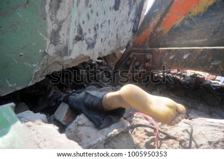DHAKA, BANGLADESH - APRIL 24, 2013: Rescue workers try rescue trapped garment workers in the Rana plaza building which collapsed in Saver near Dhaka, Bangladesh on April 24, 2013.