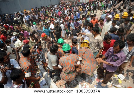 DHAKA, BANGLADESH - APRIL 24, 2013: Rescue workers try rescue trapped garment workers in the Rana plaza building which collapsed in Saver near Dhaka, Bangladesh on April 24, 2013.