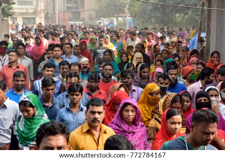 DHAKA, BANGLADESH - DECEMBER 26, 2016: Bangladeshi garments workers return home after finish their work at Ashulia in Dhaka, Bangladesh on December 26, 2016.