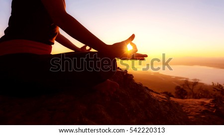 Young woman practicing yoga(yoga lotus meditation).
