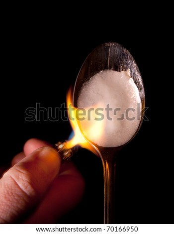 Cook cocaine on a spoon