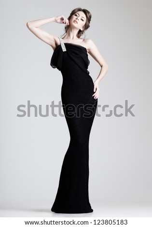 https://thumb1.shutterstock.com/display_pic_with_logo/173680/123805183/stock-photo-beautiful-woman-model-posing-in-elegant-dress-in-the-studio-123805183.jpg