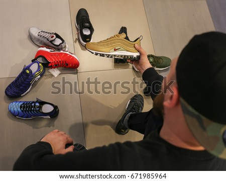 Nike store. Man buys sneakers Nike Air Max - Ukraine, Kiev - June 20, 2017