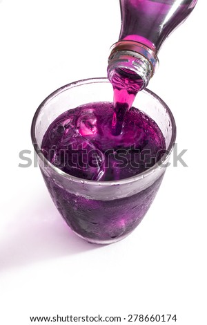 pouring grape juice - stock photo