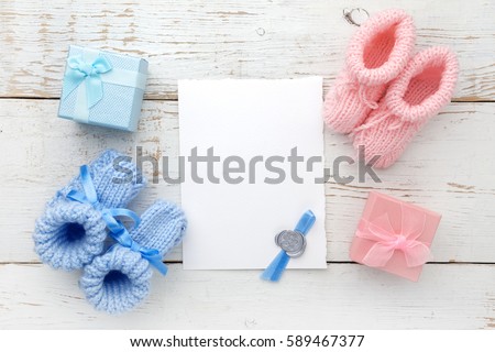 Set of baby girl and boy booties and greeting card form. Top view