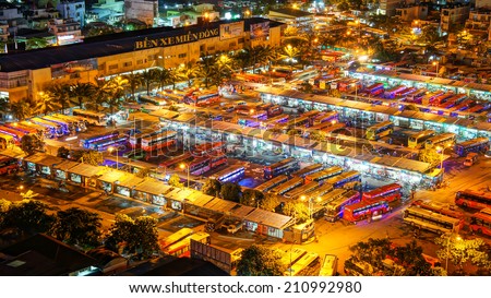 HO CHI MINH CITY, VIETNAM- AUG 14 : Panaromic of Mien Dong bus station at night, group of colorful car wait, this depot has many public passenger transport vehicle at Sai gon, Vietnam, Aug 14, 2014