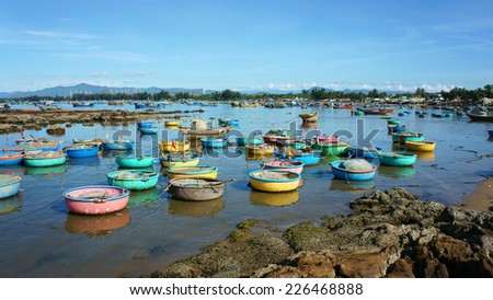 Great landscape of Asian country, colorful Vietnamese beach with group of vibrant coracle on seaside, blue sky, fresh air in sunny day, amazing sight for Vietnam travel at fishing village in summer