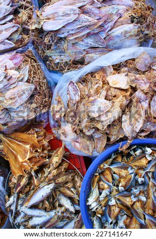 Dried shredded squid, seafood product, made from squid or cuttlefish, commonly found in coastal Asian, show at Vietnam open air market, is popular street snack