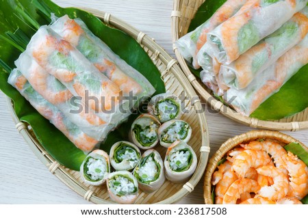Vietnamese food, goi cuon is street food, roll that delicious, wrapped from shrimp, pork, vegetables, bun in rice paper, with accompaniments: sauce, chili, another name: salad roll, soft roll..
