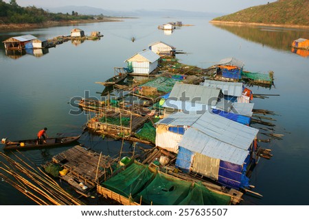 DAKLAK, VIET NAM- FEB 26: Asian residence on water, group of floating house of fishing village, beautiful Vietnamese countryside, impression panoramic, Dak Lak, Vietnam, Feb 26, 2015