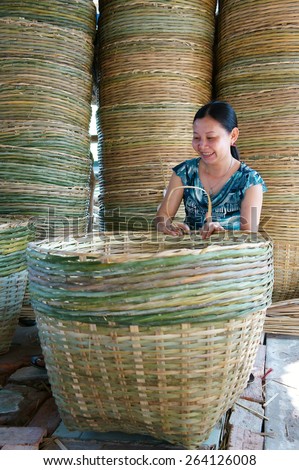 VINH LONG, VIET NAM- MAR 24: Asia trade village at Mekong Delta, Vietnamese people work inside to make basket from bamboo material, clever hand and hard working to make product, Vietnam, Mar 24, 2015