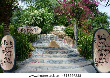 QUY NHON, VIET NAM- AUG 23: Han Mac Tu, a fomous Vietnamese poet, short life artist, his grave at Genh Rang tourist area, poem in calligraphy on wooden background, Quynhon, Vietnam, Aug 23, 2015